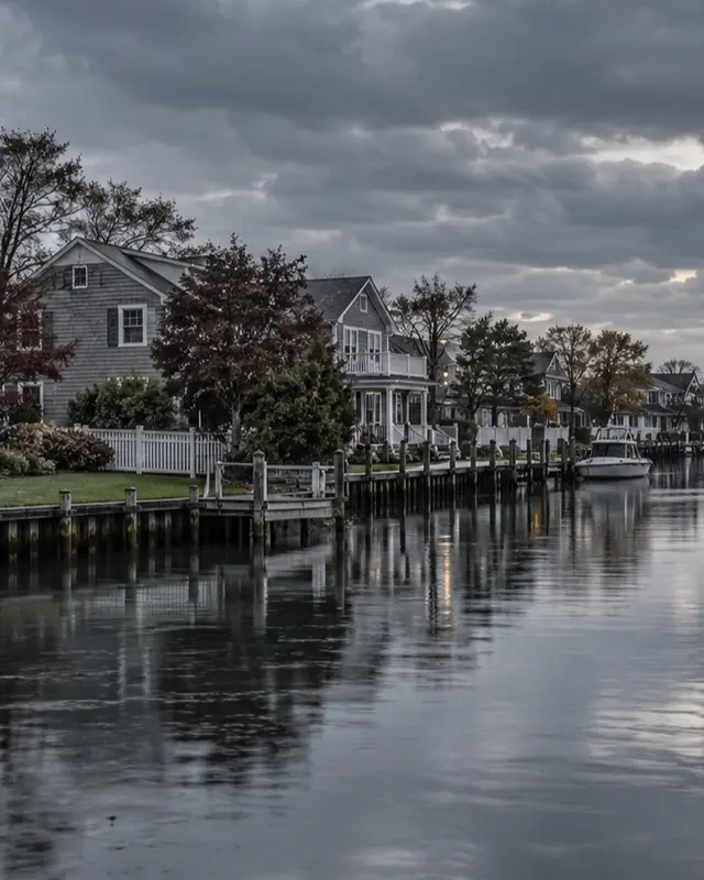 Amityville canal-side homes after rain, closer residential view