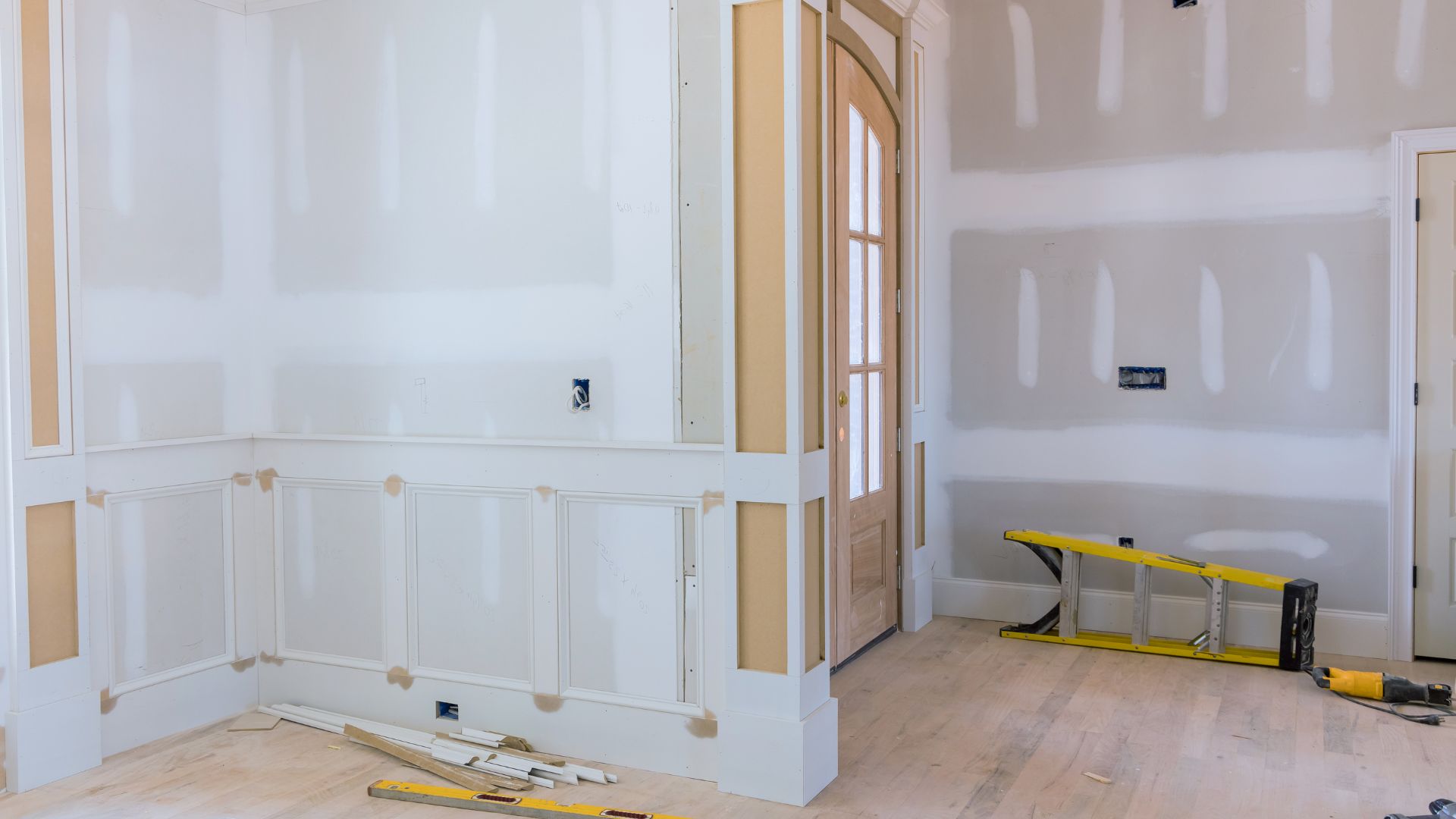 A room that is being remodeled with white paint