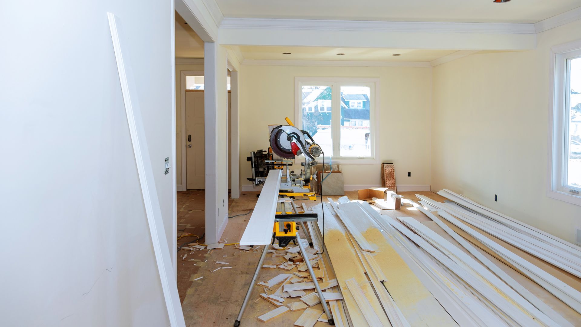 A room that has a lot of wood on the floor